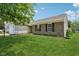Single-story home featuring brick accents, a well-maintained lawn, and mature trees at 17357 Austrian Pine Way, Westfield, IN 46074