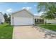 Picture of a well maintained home exterior with a wide driveway and manicured lawn at 17357 Austrian Pine Way, Westfield, IN 46074