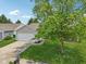 The property is well-landscaped with a lush lawn and mature shade trees at 17357 Austrian Pine Way, Westfield, IN 46074