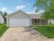 Charming single-story home featuring a two-car garage and a well-maintained front yard with mature trees at 17357 Austrian Pine Way, Westfield, IN 46074