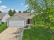 The home features a well-maintained lawn and a two-car garage at 17357 Austrian Pine Way, Westfield, IN 46074