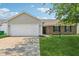 A charming one-story home with a well-kept lawn and an attached garage at 17357 Austrian Pine Way, Westfield, IN 46074