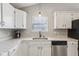 Clean kitchen design with white cabinets, granite countertops, and stainless steel dishwasher at 17357 Austrian Pine Way, Westfield, IN 46074