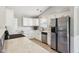 Bright kitchen featuring white cabinets, stainless steel appliances and stone countertops at 17357 Austrian Pine Way, Westfield, IN 46074
