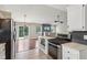 Well-designed kitchen next to the living room featuring modern stainless steel appliances at 17357 Austrian Pine Way, Westfield, IN 46074