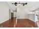 Hardwood floors in a spacious living room with an open floor plan and views into the kitchen at 17357 Austrian Pine Way, Westfield, IN 46074