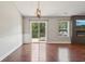 Living room featuring wood floors, wainscoting, sliding glass doors and a fireplace at 17357 Austrian Pine Way, Westfield, IN 46074