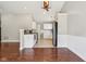 Open concept kitchen and living area with wood floors and modern appliances at 17357 Austrian Pine Way, Westfield, IN 46074