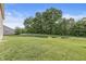 Lush green backyard next to mature trees and walking path at 1829 Archbury Dr, Avon, IN 46123
