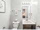 Bathroom features a vanity with a framed mirror and a decorative toilet at 1829 Archbury Dr, Avon, IN 46123