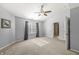 Bedroom with vaulted ceiling and a ceiling fan, window with natural light, and an ensuite door at 1829 Archbury Dr, Avon, IN 46123