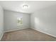 Neutral bedroom offering comfortable carpet and a well lit window at 1829 Archbury Dr, Avon, IN 46123