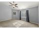 A simple bedroom with neutral walls and carpet, featuring a window with natural light and privacy blinds at 1829 Archbury Dr, Avon, IN 46123