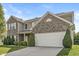 Beautiful two-story home featuring manicured landscaping and a two-car garage at 1829 Archbury Dr, Avon, IN 46123