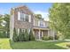 Charming two-story home featuring a brick facade and a well-manicured lawn with beautiful shrubbery at 1829 Archbury Dr, Avon, IN 46123