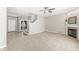 Cozy living room with fireplace, neutral color palette, and plenty of natural light at 1829 Archbury Dr, Avon, IN 46123