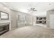 Bright living room features a fireplace and an open layout to the kitchen at 1829 Archbury Dr, Avon, IN 46123