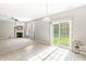 Bright living room with a cozy fireplace and sliding doors to the backyard at 1829 Archbury Dr, Avon, IN 46123