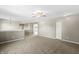 Open loft area with carpet flooring, neutral walls, and ample lighting throughout at 1829 Archbury Dr, Avon, IN 46123