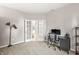 Comfortable carpeted office space featuring a desk and chair with white french doors to another room at 1829 Archbury Dr, Avon, IN 46123