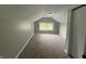 Bedroom featuring neutral walls, carpet flooring, a window, closet and an overhead light at 204 S Conger St, Saint Paul, IN 47272