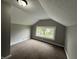 This bedroom features neutral walls, carpeting, and a window that provides natural light at 204 S Conger St, Saint Paul, IN 47272
