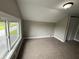 Bedroom featuring neutral walls, carpet flooring, a window, closet and an overhead light at 204 S Conger St, Saint Paul, IN 47272