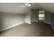 Bedroom featuring neutral walls, carpet flooring, a window, closet and an overhead light at 204 S Conger St, Saint Paul, IN 47272