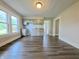 Eat-in kitchen featuring hardwood floors, gray cabinets, and lots of natural light at 204 S Conger St, Saint Paul, IN 47272