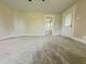 Spacious living room featuring new carpet, light walls, and updated fixtures at 204 S Conger St, Saint Paul, IN 47272