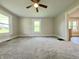 Bright and airy living room with new carpet, light walls, and updated fixtures at 204 S Conger St, Saint Paul, IN 47272