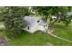 Charming home featuring a well-maintained lawn, mature trees, and concrete steps at 204 S Conger St, Saint Paul, IN 47272