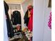 Walk-in closet with hanging clothes and shoes, featuring shelving and storage space at 2041 Mckinley Ave, Columbus, IN 47201