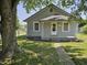 Charming single-story home with a welcoming front porch and well-maintained lawn at 2041 Mckinley Ave, Columbus, IN 47201