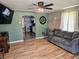Living room with hardwood flooring, a view into the kitchen and comfortable sofa at 2041 Mckinley Ave, Columbus, IN 47201