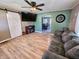 Inviting living room featuring wood flooring, a ceiling fan, and an archway to another room at 2041 Mckinley Ave, Columbus, IN 47201