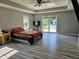 Spacious main bedroom featuring a ceiling fan, hardwood floors and access to backyard pool at 2041 Mckinley Ave, Columbus, IN 47201