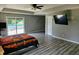 Spacious main bedroom featuring hardwood floors, ample natural light, and access to backyard pool at 2041 Mckinley Ave, Columbus, IN 47201