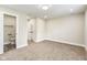 Basement with neutral carpet and a view to a bathroom at 2427 N Rural St, Indianapolis, IN 46218