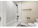 Renovated bathroom with white tile and matte black finishes at 2427 N Rural St, Indianapolis, IN 46218