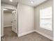 Bedroom with neutral carpet, paint, and natural light at 2427 N Rural St, Indianapolis, IN 46218