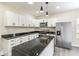 Stylish kitchen showcasing granite countertops, stainless steel appliances, a large island, and ample storage space at 2427 N Rural St, Indianapolis, IN 46218