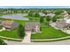 Stunning aerial view of a charming home with a well-manicured lawn and a serene pond at 2434 Burgundy Way, Plainfield, IN 46168