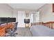 Cozy bedroom features a wooden frame bed, a desk with dual monitors, and neutral-toned walls at 2434 Burgundy Way, Plainfield, IN 46168