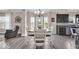 Bright dining space with a wooden table, chair seating for six, next to the kitchen area at 2434 Burgundy Way, Plainfield, IN 46168
