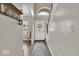Bright entryway showcases modern flooring, arched doorways, and a staircase with white risers at 2434 Burgundy Way, Plainfield, IN 46168