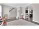 Welcoming entryway featuring access to the kitchen, stairs, and playroom providing a bright space for Gathering activities at 2434 Burgundy Way, Plainfield, IN 46168