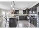 Modern kitchen features sleek black cabinetry, stainless steel appliances, and a stylish island at 2434 Burgundy Way, Plainfield, IN 46168