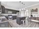 Charming kitchen with dark cabinetry, stainless appliances, and a cozy island with seating at 2434 Burgundy Way, Plainfield, IN 46168