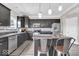 Stylish kitchen featuring dark cabinets, stainless steel appliances, and modern fixtures at 2434 Burgundy Way, Plainfield, IN 46168